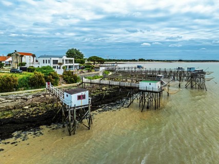 Fishing huts over Randonnee entre Histoire et Nature from a drone, Fouras, Fouras-les-Bains,