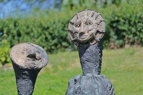 Sculpture Sun and Moon by Markus Lüpertz 2017, modern art, bronze sculpture, two faces, moon face,