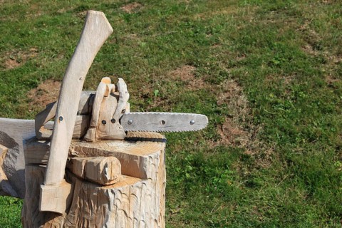 Chainsaw and axe carved from wood as decoration