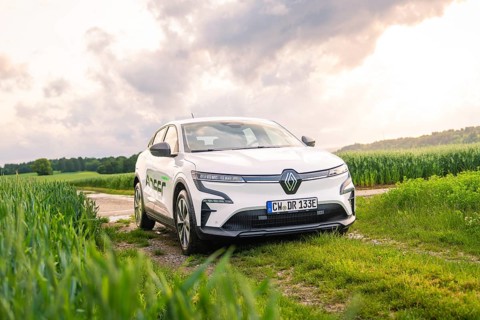 A white Renault vehicle parked on a dirt track under a cloudy sky, Deer E- CarSharing, Renault