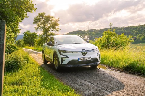 Car on a sunny path through a green, cloudy landscape, Deer E- CarSharing, Renault Megane electric
