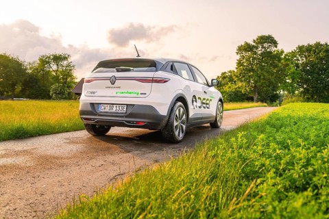 Renault on a country road, surrounded by lush green meadows and trees, Deer E- CarSharing, Renault