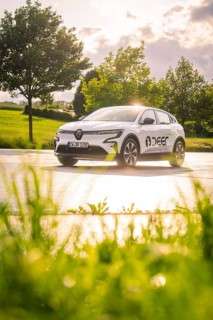 White car on wet road, sun rays reflecting, rural environment, Deer E- CarSharing, Renault Megane