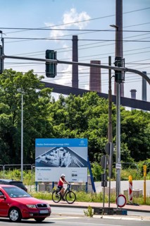 Construction site sign for thyssenkrupp Steel's first direct reduction plant, the climate-neutral