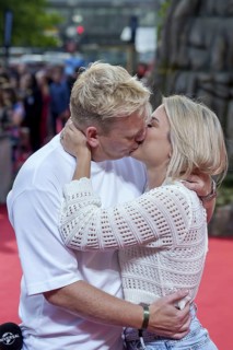 Jens Knossi Knossalla with girlfriend Lia Mitrou (influencer) at the German premiere of the