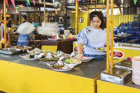 Selection of prepared foods available for customers at a buffet style outdoor restaurant in Chiang