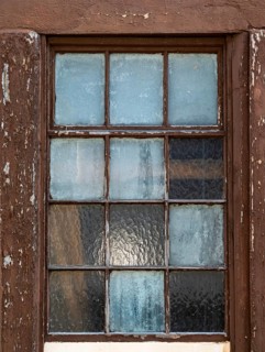 Old window with weathered wooden frame and frosted glass, reflects light, Bad Bergzabern, Southern