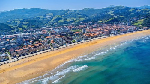 Aerial view of zarautz, gipuzkoa, showcasing the golden sands meeting the turquoise waves of the