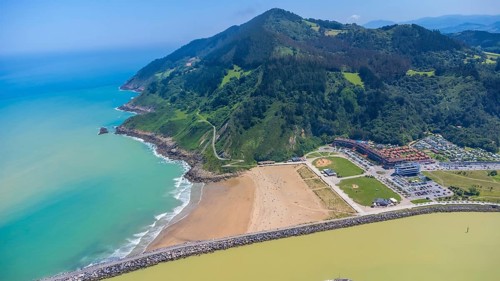 Aerial perspective captures the stunning coastal beauty of orio, spain, showcasing the beach,