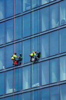 Detroit, Michigan - Window washers at the 25-story Residences Water Square luxury apartment
