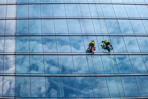 Detroit, Michigan - Window washers at the 25-story Residences Water Square luxury apartment