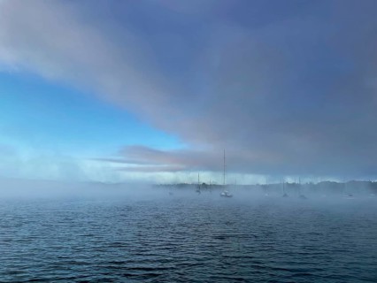Sailing boats on Lake Starnberg with fog, Bavaria, Germany