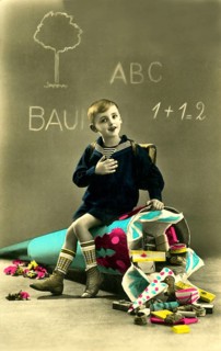 Child giant school cone, 1930s, boy sitting on a fallen school cone in front of a blackboard, toys