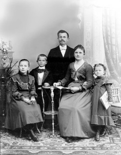 Father Mother Boy Girl, 1920s, A formal family portrait with parents and three children in