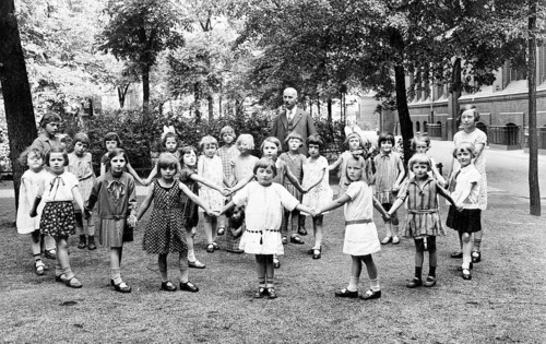 School class girls teachers schoolyard, 1920s, A group of children holding hands on an outdoor