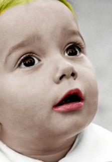 Little boy amazed, 1930s, close-up of a child with red coloured lips and astonished expression,