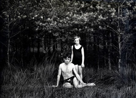Brother and sister in swimming costumes, 1930s, Two people in swimming costumes in a forest, one