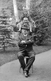 Family, 1930s, Three people stacked on top of each other in the forest, black and white photo with