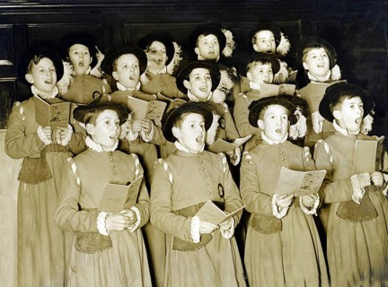 Traditional boys' choir, 1930s, group of children in historical costumes singing together in a