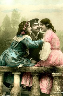 Man with 2 woman, 1920, Two woman in colourful dresses and a man in uniform sitting in