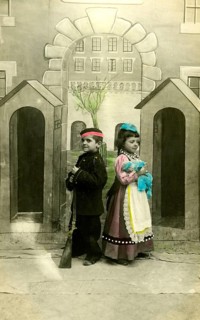 2 children dressed up, 1920, Two children in costumes with toy gun, in front of a painted scenery,