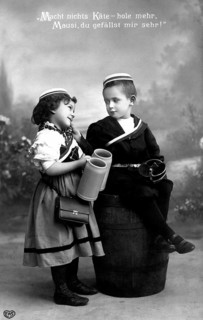 Boy and girl flirting, 1920, Boy and girl in old-fashioned clothes, in a humorous scene with