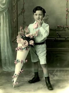 Boy with school cone, 1930s, A little boy in a suit with a large, decorative bouquet of flowers,