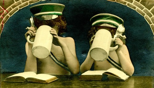Two children with jugs, 1910s, Two children drinking from large jugs and sitting with open books,