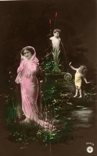 Woman and girl in front of a fountain, 1910s, Woman with pink veil and children in a flowery pond,