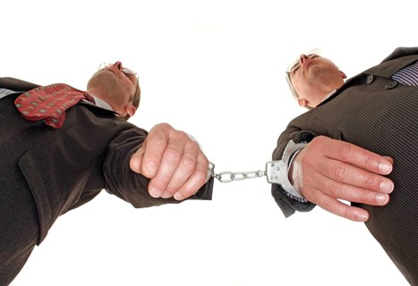 Businessman, two, handcuffs, suit and tie, Berlin, Germany, low angle shot of two men in handcuffs