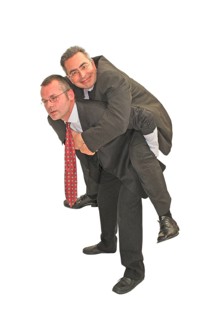 Businessman, two, burden, freeloader, suit and tie, Berlin, Germany, One man piggybacking another