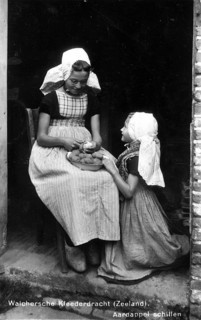 Peeling potatoes, 1920s, Two woman in traditional Seeland traditional costume peeling potatoes on