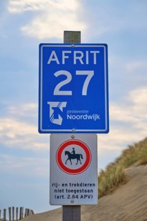 Two beach signs with a note, at the edge of the dunes, beach section 27, Noordwijk, North Sea,