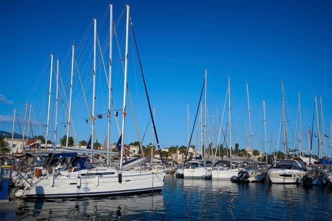 A harbour full of sailing boats and yachts against a clear blue sky, Marina, Kos Town, Kos,