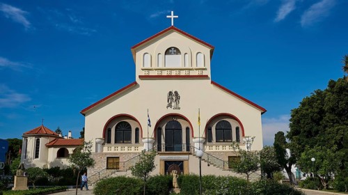 Frontal view of a church with a cross in front of a blue sky, Kos Cathedral, Kos Town, Kos,