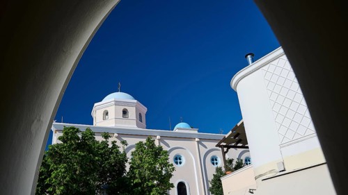 View of a sacred church with dome through an arch under a clear sky, Agia Paraskevi Church, Kos