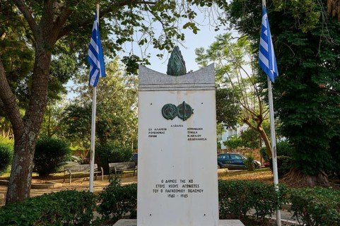 Monument in a park-like setting with flags and surrounded by lush trees, Memorial, Wars 1940-1945,