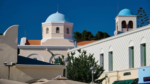 Mediterranean building with domes and steeple in vivid colours, Agia Paraskevi Church, Kos Town,