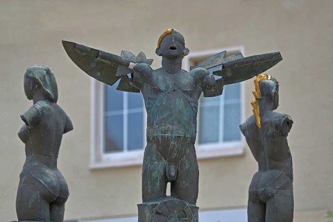 Market fountain with sculptures by Christof Traub 1995, three symbols fire, water and wind, torso,