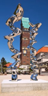Stainless steel sculpture entitled Points of View by Tony Cragg in front of the Wedding Tower,