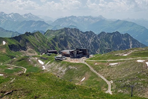 Edmund-Probst-Haus and Höfatsblick mountain station of the Nebelhornbahn, behind mountains of the