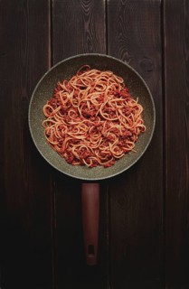 Spaghetti bolognese, in a frying pan, top view, homemade, no people
