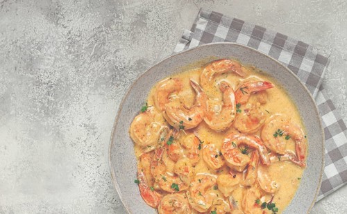 Shrimp in creamy garlic sauce, with spices and herbs
