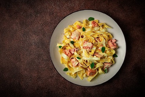 Tagliatelle pasta, in cream sauce with salmon, homemade, no people