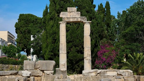 ©Udo Rein, Columned ruins against a backdrop of dense greenery and blossoming trees, Temple of