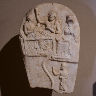 ©Udo Rein, Antique stone relief with several figures in scene, banquet of the dead, snake, Casa