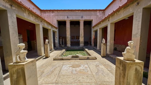 ©Udo Rein, Ancient courtyard with statues and mosaic floor between columns, water basin, Casa
