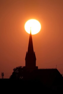 Sun in the evening in June, church tower, Germany