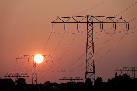 Transmission of energy with high-voltage lines, symbolic image for the energy transition, evening