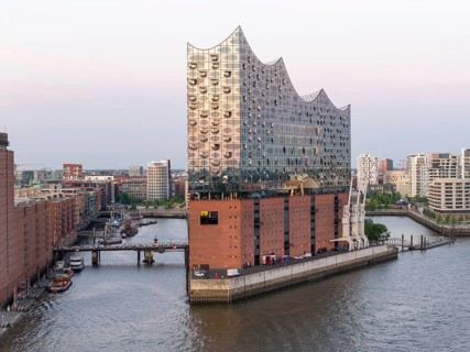 The Elbphilharmonie concert hall in Hamburg is reflected in the glass design above the historic